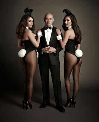 Pictured left to right: Playboy's 2012 Playmate of the Year Jaclyn Swedberg, Pitbull, Playboy's 2013 Playmate of the Year Raquel Pomplun. Photo: Playboy Enterprises / Chapman Baehler.