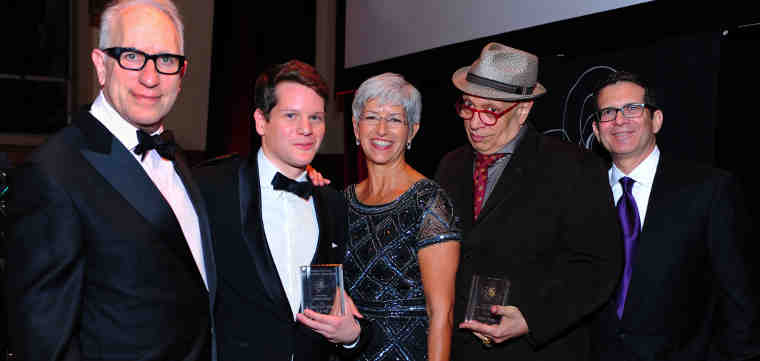 From left to right: Scripter Selection Committee Chair Howard Rodman, Scripter Award-winning screenwriter Graham Moore, Dean of the USC Libraries Catherine Quinlan, USC Libraries Literary Achievement Award winner Walter Mosley, and master of ceremonies Glenn Sonnenberg