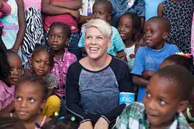 P!nk visits with children during her recent trip to Haiti with UNICEF.