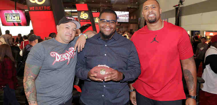 NFL Network debuts new reality series "Tackle My Ride," starring Super Bowl Champion LaMarr Woodley, right, and Demented Customs master car builder, James Torrez, left, with featured Cleveland fan, Joe Whitthorne, at 2016 SEMA Show in Las Vegas Wednesday, Nov. 2, 2016