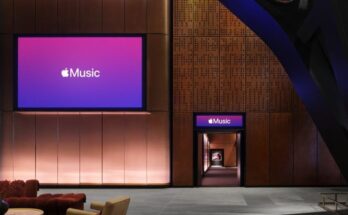 Interior of Apple Music Hall featuring the 38-foot stage, audience seating area, and architectural heritage brickwork at Battersea Power Station in London.