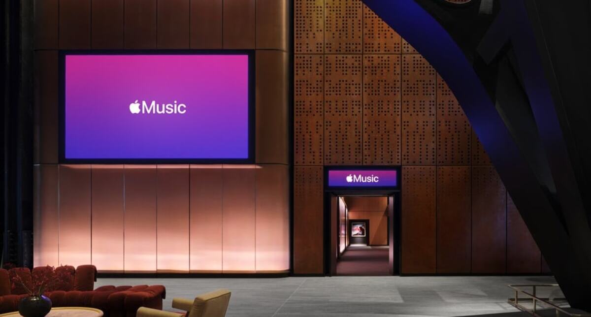 Interior of Apple Music Hall featuring the 38-foot stage, audience seating area, and architectural heritage brickwork at Battersea Power Station in London.